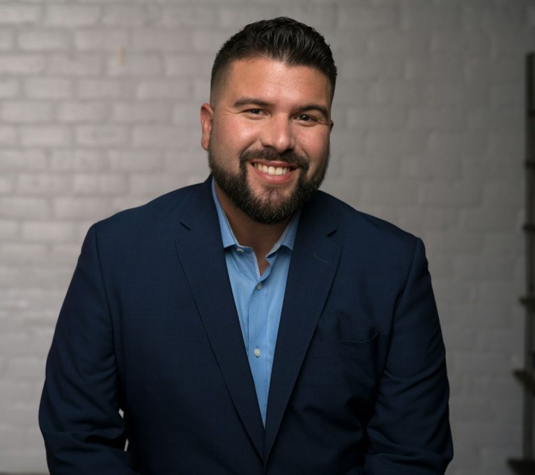 man in blue suit jacket